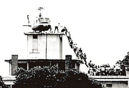 In this iconic photo that has come to symbolize the fall of Saigon, Vietnamese citizens line up for evacuation by an Air America helicopter from the roof of the Pittman Apartments building in Saigon.  For nearly 40 years, the location in this photo has been mistakenly identified as the U.S. Embassy.  It is not.