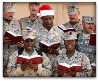 US troops pause to enjoy Christmas carols, even in a war zone.