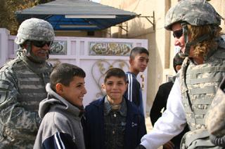Gold Star Mom Debbie Lee, proud mother of Marc Lee, the first Navy SEAL killed in Iraq, dons body armor to meet Iraqi children in the same streets where her youngest child died.